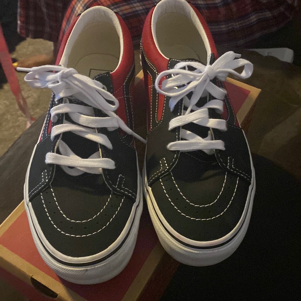 Red and black low top vans